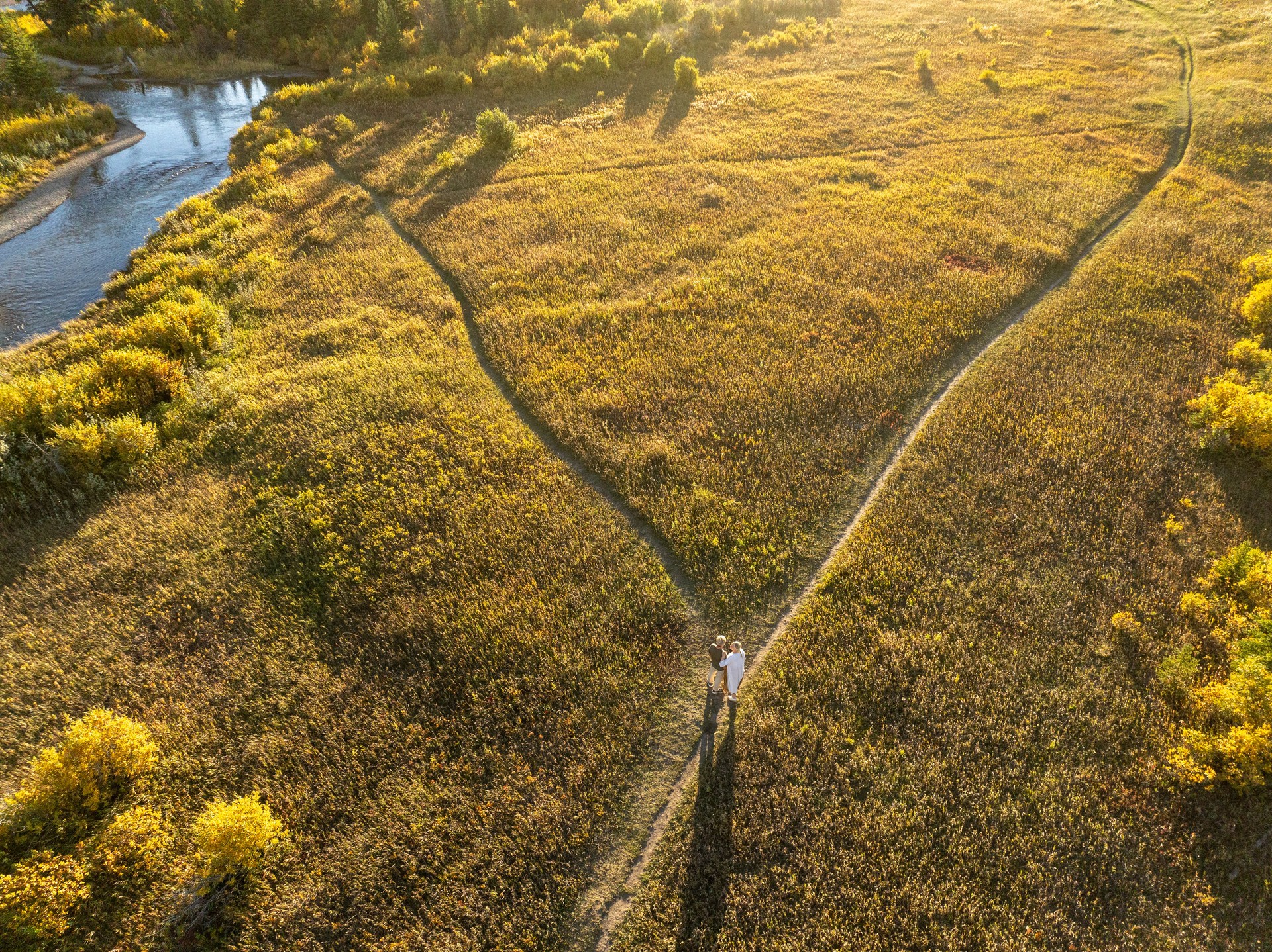 Aerial view of mature couple at intersection of pathway