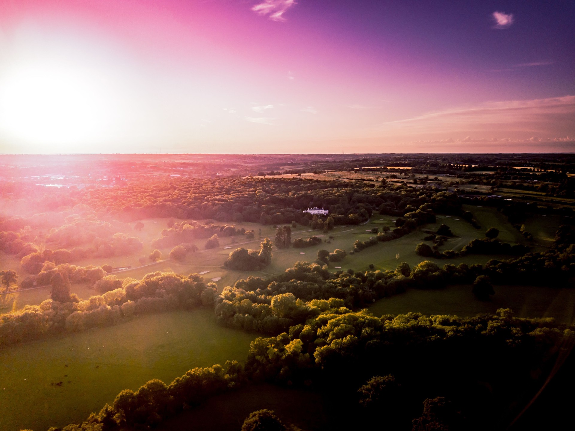 Aerial view of the countryside around London taken at sun set.